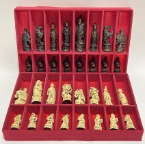 A full boxed set of Gino Ferrari resin chess pieces modelled as Chinese figures