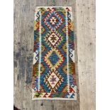 A Chobi kilim flat weave runner rug of characteristic design 148cm x 63cm