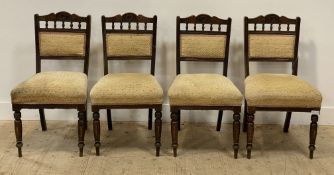 A set of four Victorian stained hardwood dining chairs with upholstered back and seat, turned