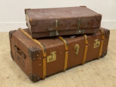 An early 20th century stained beech bound cabin trunk with leather carry handle to each end (