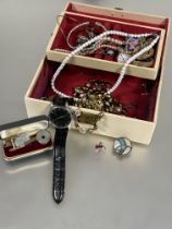 A white jewellery box containing a collection of costume jewellery including paste pearl necklace,