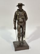 A cast metal standing figure a Cambridge sailor with sword and bronzed finish raised on square base,