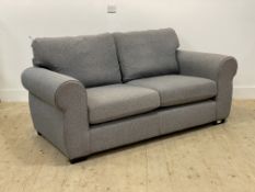 A modern grey two seater sofa with squab cushions raised on square tapered supports