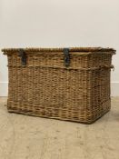 A large vintage wicker lidded laundry or log basket, with carry handle to each end. W75cm.