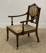 An Edwardian inlaid rosewood open armchair, with upholstered back and seat, raised on square tapered