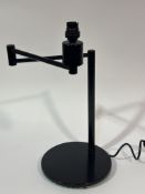 A modern black enamel finish column swing action reading bedside lamp on circular base, (H x 42 cm)