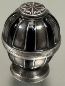 A Danish sterling silver bean shaped taper candle stick holder raised on three prong supports, (L