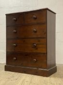 A Victorian style stained pine chest, fitted with two short and three long drawers raised on a