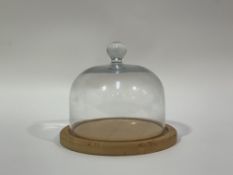 A glass cheese dome on a circular wooden base. (h-22cm w-20cm) (no signs of chips to rim)