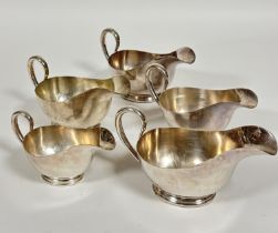 A set of three Epns sauce boats with C scroll handles and two similar smaller, (H x 11 cm x L x 19 x