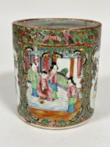 A late 19thc Chinese Canton brush washer pot decorated with traditional figures in interior scene