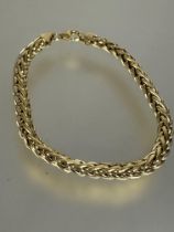 A 9ct gold lattice link chain bracelet with lobster claw fastening, no signs of damage or hard