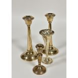 A pair of Birmingham silver tapered column weighted circular candle sticks, damage to tops and and