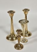 A pair of Birmingham silver tapered column weighted circular candle sticks, damage to tops and and