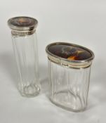 Two Birmingham silver tortoise inlaid topped dressing table jars with paneled sides, tallest top a/