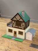 A model dolls house with mock Tudor facade and terrace (H71cm, W56cm, D60cm) together with a model