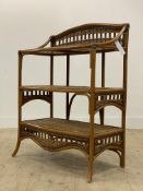 A 1970's bamboo and rattan three tier wall shelf. H103cm, W77cm, D43cm.