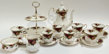 A Royal Albert 'Old Country Roses' tea set comprising a cake stand, a teapot (h- 24cm, w- 21cm), thr