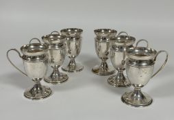A set of six Epns syllabub cups with handle to side and lift out outer-cup on circular bases, (H x