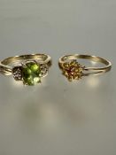 A 9ct gold citrine cluster ring O and a 9ct gold peridot ring and paste set ring N/O 5.31g (2)