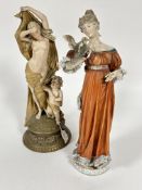 A late 19thc Austrian Turen porcelain female figure with cherub raised on molded circular base  H