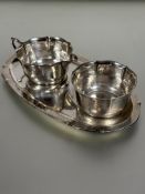 A early 20thc German WMF 835 standard white metal oval tray with milk jug and sugar basin of lotus