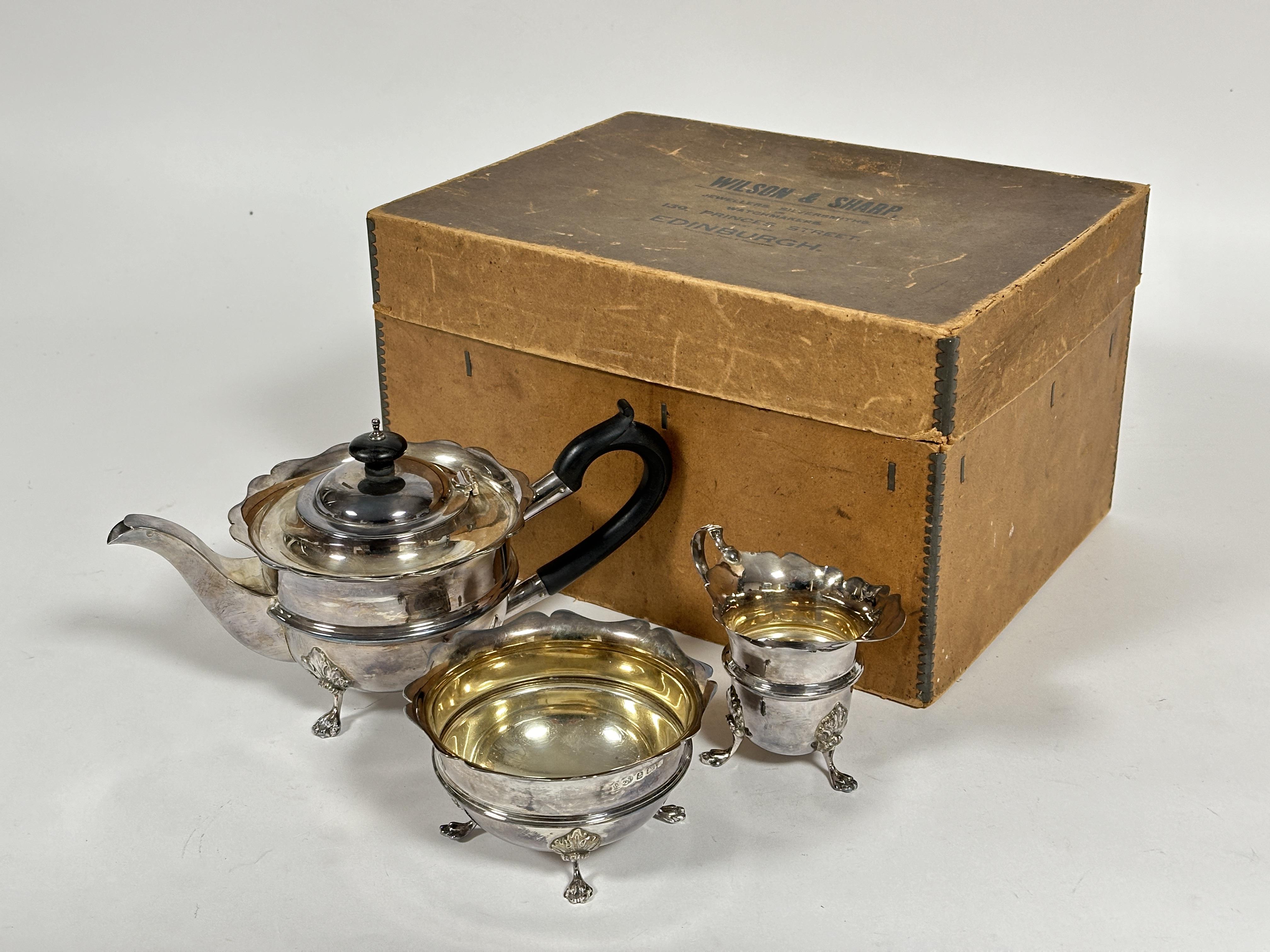 A Edwardian Wilson & Sharp of Edinburgh silver three piece silver morning tea service comprising tea
