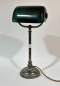 An Art Deco brass metal and green glass banker desk lamp, with switch to base. (h-47.5cm)