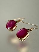 A pair of 9ct gold set pink oval gem stones earrings in four claw settings, L x 3cm approximately