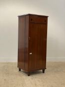 A Chinese style hardwood drinks cabinet, the single door with lozenge inlay opening to a fitted
