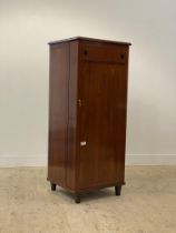 A Chinese style hardwood drinks cabinet, the single door with lozenge inlay opening to a fitted