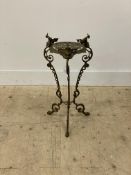 A Victorian style cast brass jardinière stand with floral motifs and three splayed supports with