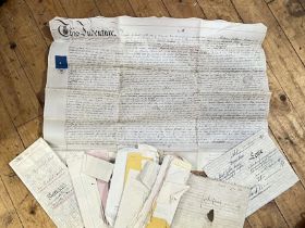 A quantity of vintage receipts and deeds, some nineteenth century and with wax seals etc...