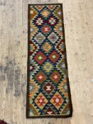 A Maimana kilim runner rug, the dark field with lozenge motif 193cm x 63