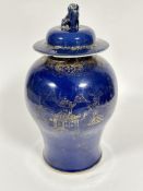 A early 19thc Chinese porcelain dark blue and gilt baluster vase  and cover with landscape scene