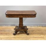 A William IV mahogany tea table, the fold over revolving top above a well figured frieze, the