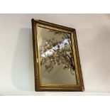 A 20thc decorative mirror in a gilt composition frame. (a/f) (57cmx45cm)