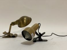 A vintage brass clip on reading light, inscribed Bryant Made in USA together with another clip on