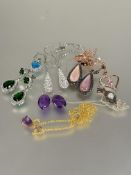 A collection of costume jewellery including a pair of green paste set pear shaped chandelier