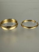 A 18ct gold wedding band Q 3.39g and an 18ct gold wedding band cut, 1.72g (2)