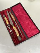 A Edwardian cased three piece horn handled carving set with silver mounts  in original fitted case