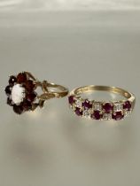 A 9ct gold seven stone ruby and diamond set alternating ring, P and a 9ct gold opal and garnet