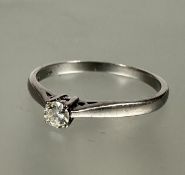 A 18ct white gold solitaire brilliant cut diamond ring, approximately 0.10ct mounted in four claw