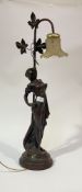 An Art Nouveau cast bronzed metal figural table lamp, with glass shade H75cm.