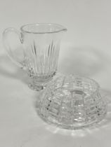 A heavy crystal tapered slice cut lemonade jug on circular base H x 19cm and a matching circular