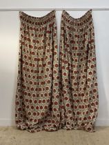 A pair of cotton lined and interlined curtains with printed floral design. (Drop 241cm, each width