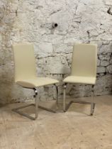 A set of six Contemporary Italian dining chairs, the seat and back upholstered in cream leather,