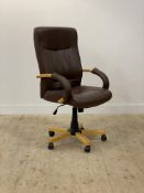 A modern high back upholstered desk chair, rising, falling, and revolving on a five point base