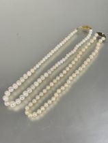 A cultured pearl necklace with silver clasp fastening  L x 20cm and a Chinese freshwater