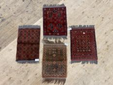 A group of four small hand knotted rugs (4)